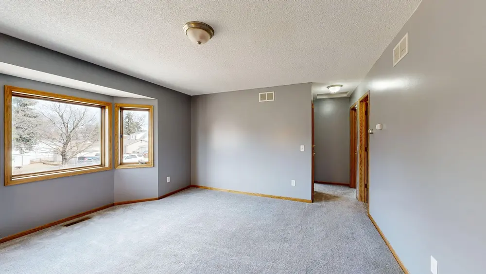 Carpet — bright empty room large windows grey