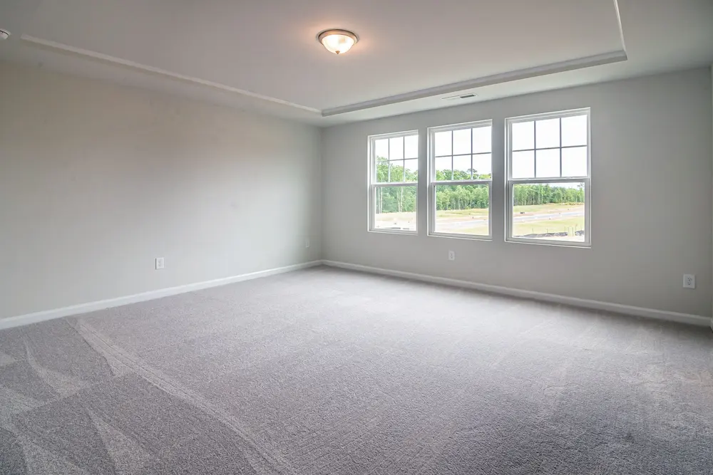 Carpet — bright spacious empty room large windows plush — near Huntington Beach, CA