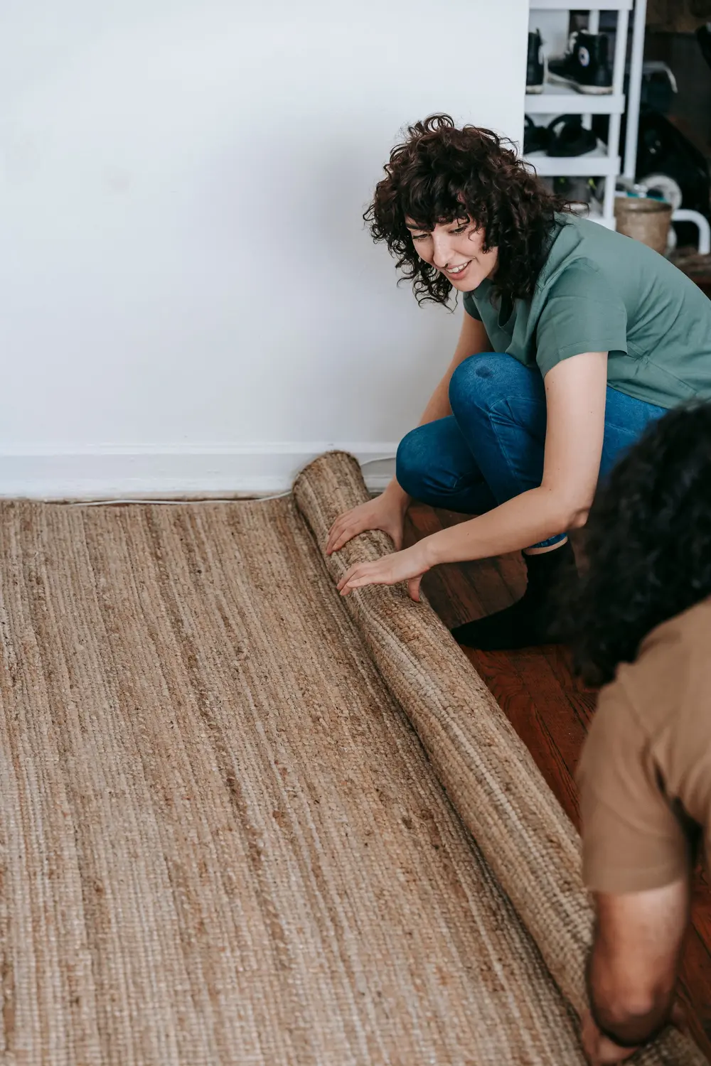 Carpet — cheerful couple unrolls their modern — near Irvine, CA