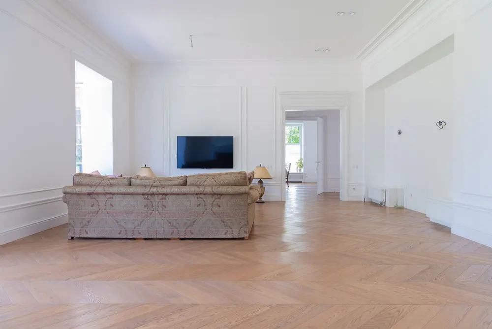 Hardwood flooring — bright elegant living room luxurious sofa
