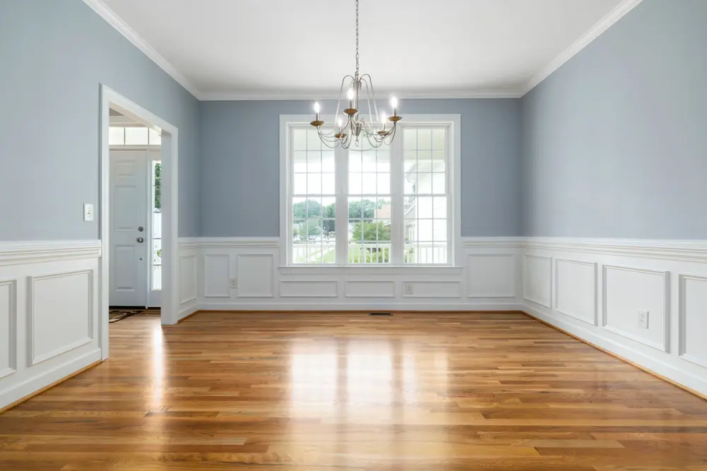 Hardwood flooring — bright empty room chandelier — flooring installed in Buena Park, CA