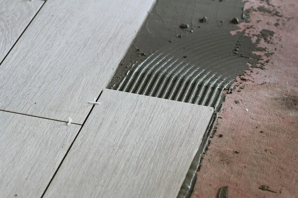 Flooring installation — building repair cement laying tile tiles tic