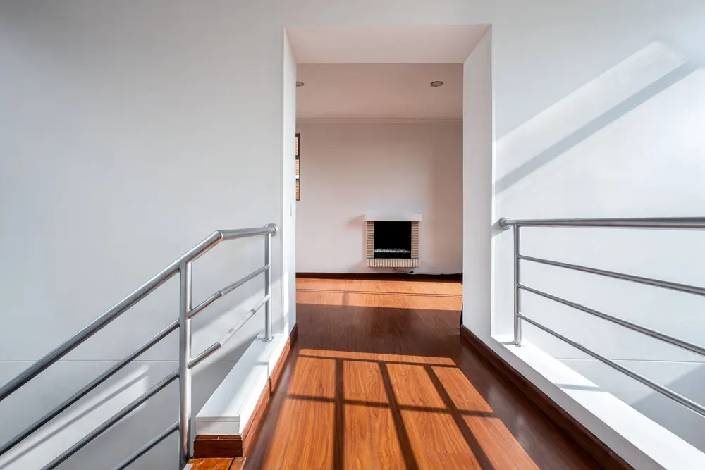 Laminate flooring — bright minimalistic hallway railings