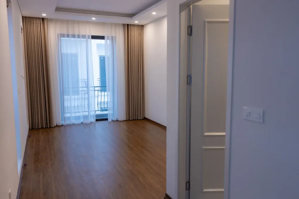Luxury vinyl plank flooring — bright empty room balcony — near La Palma, CA