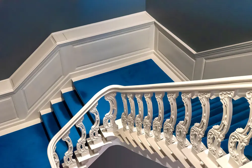 Staircase and trim work — beautifully detailed white adorned