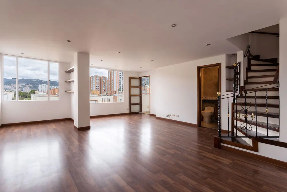 Staircase and trim work — bright empty living room large