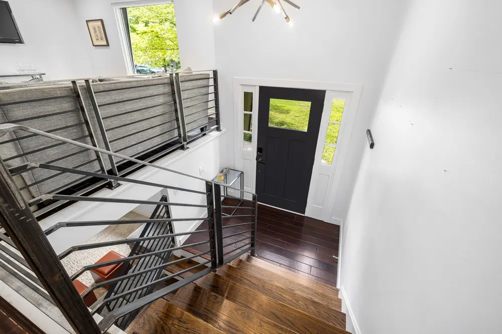 Staircase and trim work — bright modern entrance minimalist design