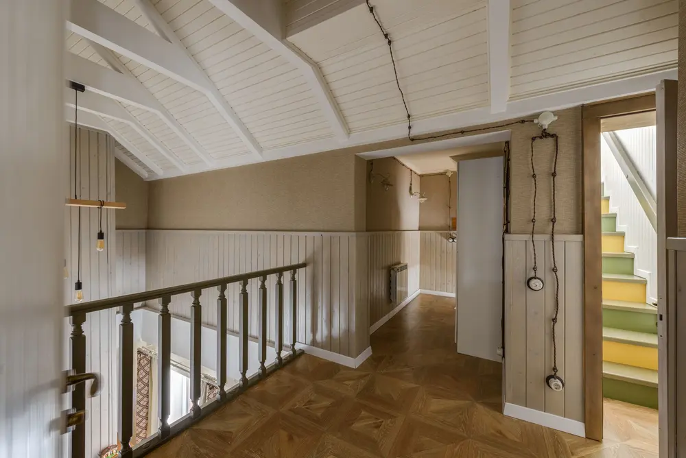 Staircase and trim work — cozy hallway interior leading