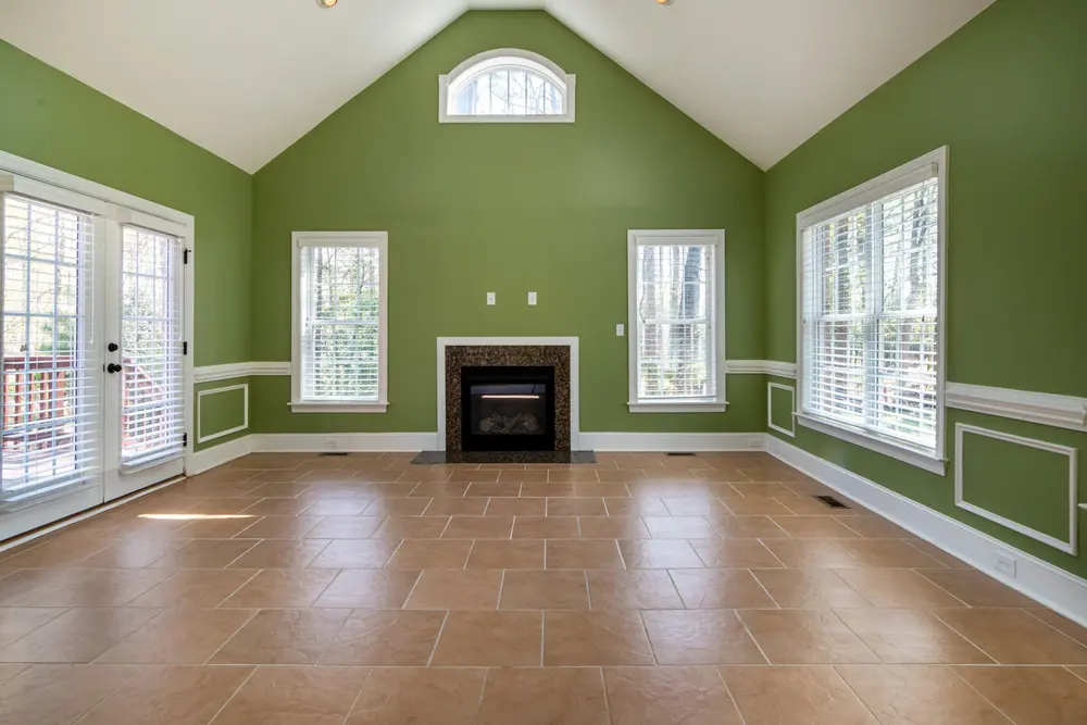 Tile flooring — elegant empty living room green walls
