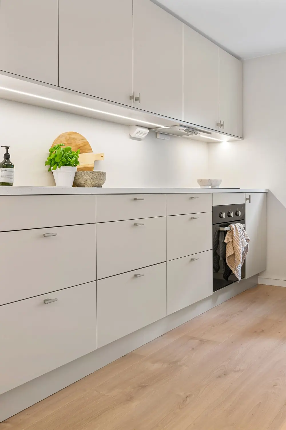 Vinyl flooring — bright clean modern kitchen white cabinetry