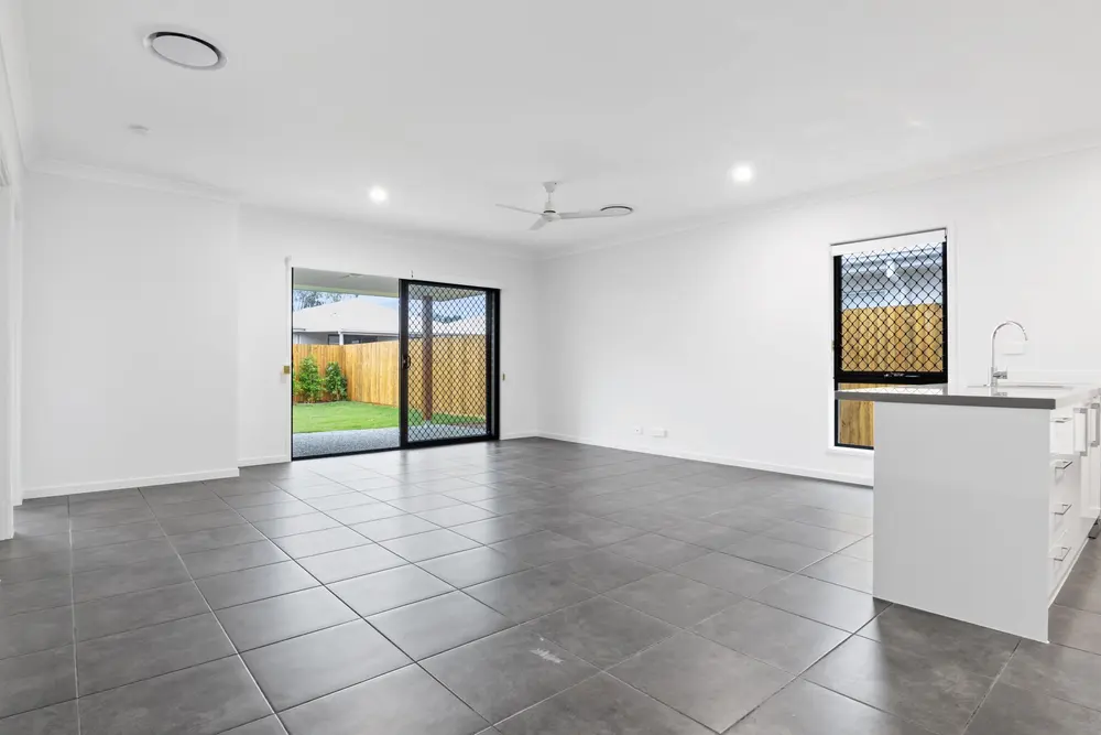 Vinyl flooring — bright empty modern living room sliding doors tiled